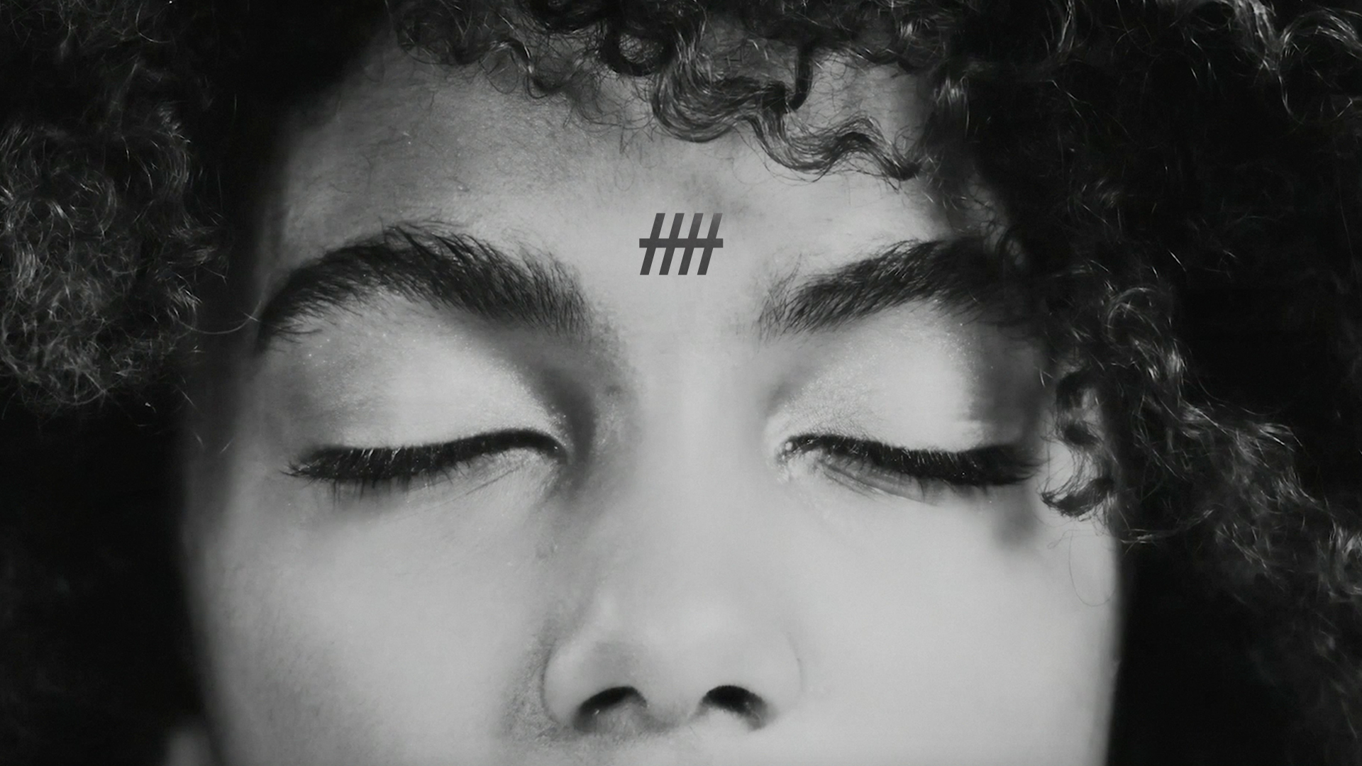 Gott — black and white close-up portrait with eyes closed
